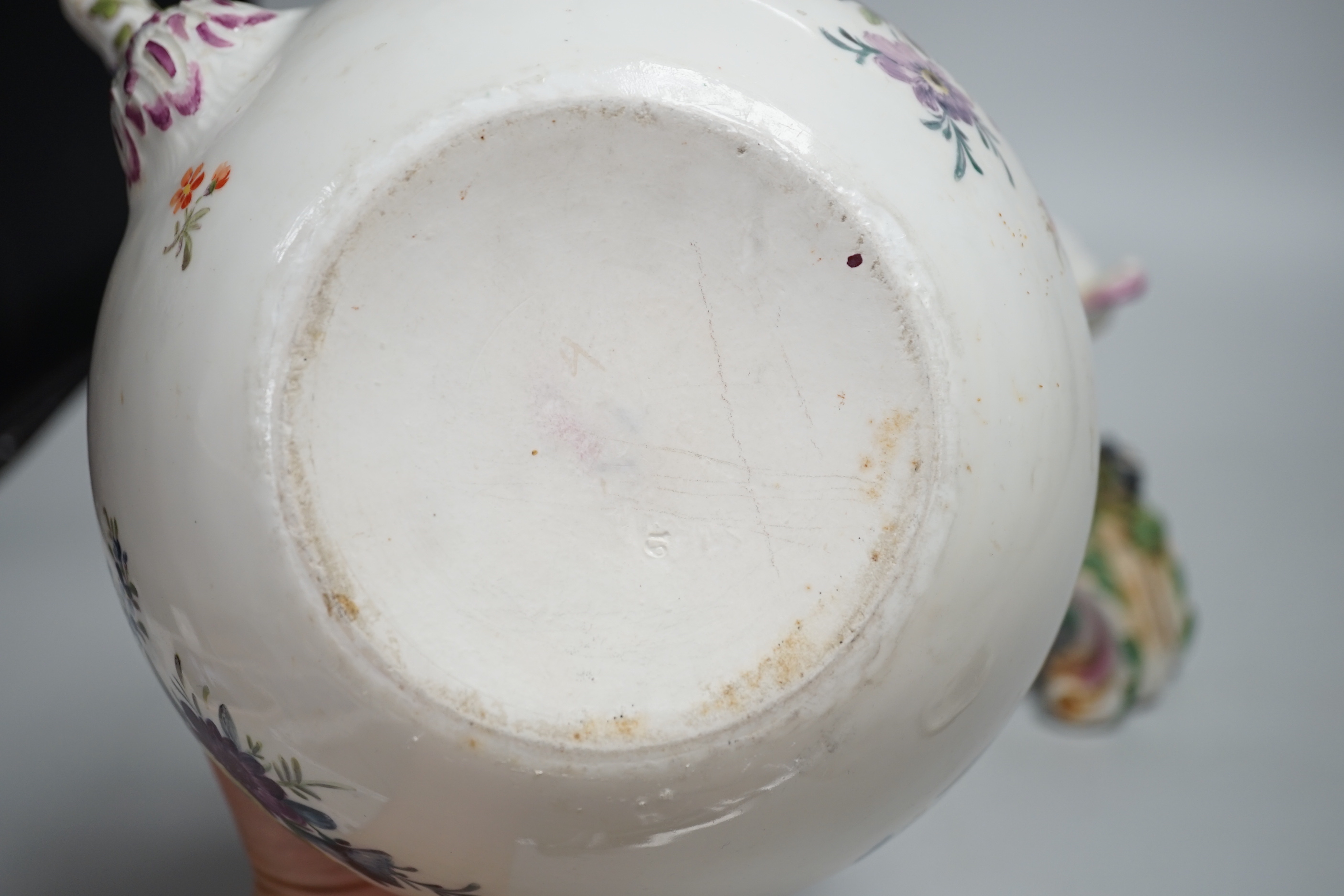 A mid 18th century Meissen teapot on a later Dresden stand with brass handle and floral decoration, height on stand 38cm